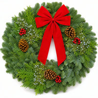 Christmas Celebration Wreath front view with red bow, pinecones and winter berries