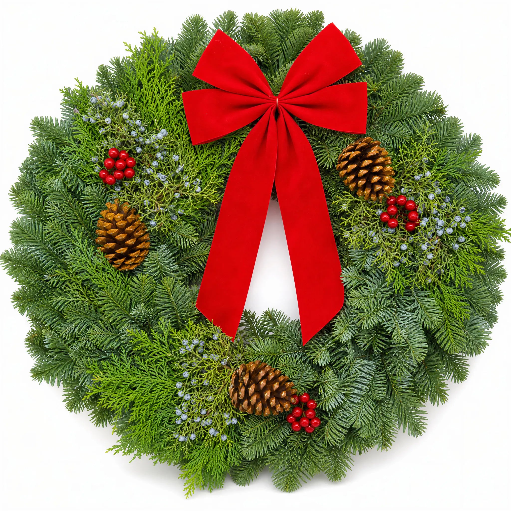 Christmas Celebration Wreath front view with red bow, pinecones and winter berries