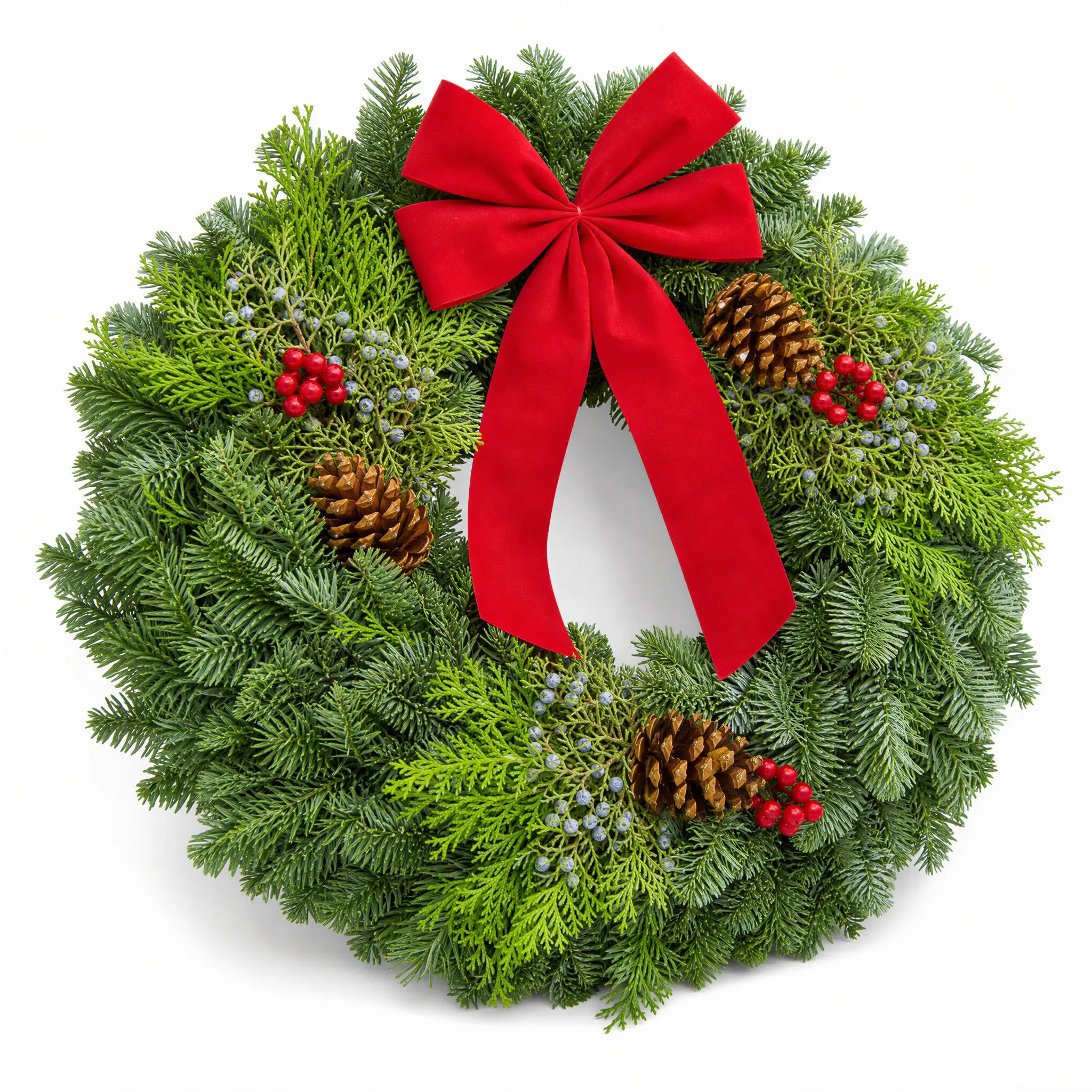 Christmas Celebration Wreath angled view with red bow, pinecones and winter berries