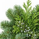 Close-up of textured green wreath foliage and winter berries