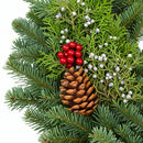 Close-up of Christmas Celebration Wreath pinecones and winter berries