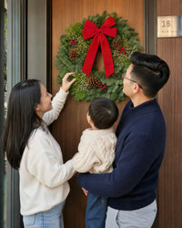 Christmas Celebration Wreath displayed at a festive family doorway